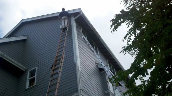 Detail work high on a tall gable